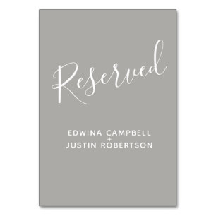 Grauer und weißer Skripttexttisch reserviert Tischnummer