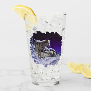 Grauwölfe im Winterschnee in der Nacht Glas