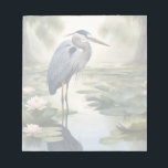 Great Blue Heron Notizblock<br><div class="desc">Dieses Bild ist eine malerische Darstellung eines Großen Blauen Helden,  der in einem Teich voller Seerosen,  umgeben von wilden Bäumen,  spaziert. Great Blue Heron ist ein von der KI generiertes Bild von Wildtieren einer von vielen Arten von Watvögeln.</div>