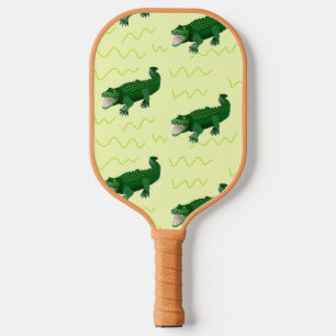 Green alligator on yellow pickleball schläger