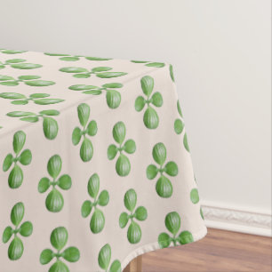 Green Jade Tree Blätter auf hellbeige Tischdecke