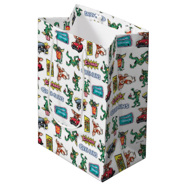 Gremlins™ Sticker-Spaß-Muster Mittlere Geschenktüte (Vorderseite Schrägansicht)