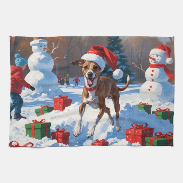 Greyhound läuft im Schnee mit Weihnachtshut Geschirrtuch (Horizontal)