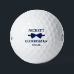 Groomsman Blue Bow Tie Golfball<br><div class="desc">These golf balls are a great favor for the groomsman in your wedding. They feature a blue bow tie with the groomsman's name above it in a modern CAP font and the word Groomsman along with the wedding date below. They'd be great for a bachelor party or weekend. The job...</div>