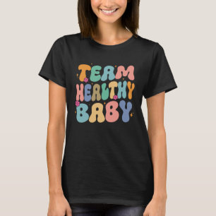 Groovy Gender enthüllt Team gesundes Baby Party Ma T-Shirt