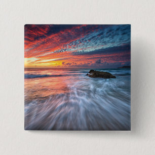 Großartiger Steinstrand des Sonnenuntergang- , EL Button