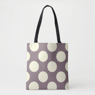 Große Sahne-Polka dotiert Kreise auf lila Tasche
