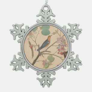 Grunddrossel und Motte auf einer Schneeflocken Zinn-Ornament