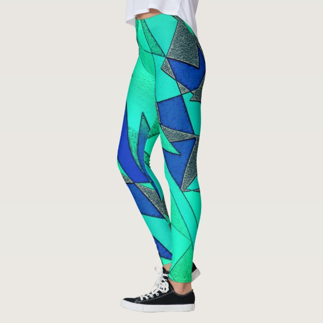 Grüne dreieckige Ausschnitte auf blauem Hintergrun Leggings (Links)