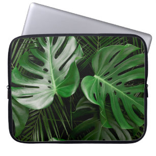Grüne Monstera-Blätter und Blätter aus Palmen Laptopschutzhülle