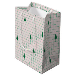 Grüne Plätze mit Weihnachtsbäumen auf Weiß Mittlere Geschenktüte