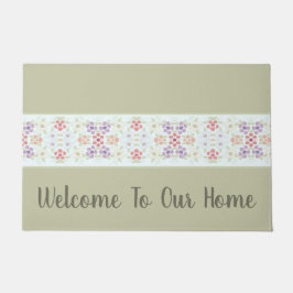 Grüne Typografie mit Pastell-Flora Fußmatte