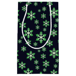 Grüne und weiße Schneeflocken mit blauem Hintergru Kleine Geschenktüte