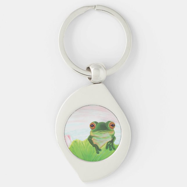 Grüner Frosch hinter dem Schlüsselanhänger des Lil (Vorderseite)