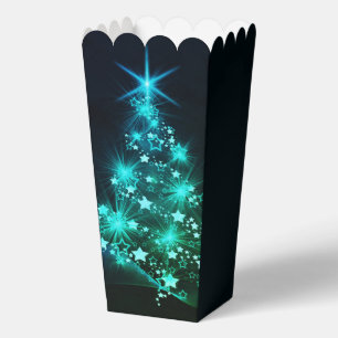 Grüner Schimmer der Sterne auf dunklem Weihnachtsb Geschenkschachtel