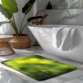 Grüner verschwommener heller Hintergrund Badematte