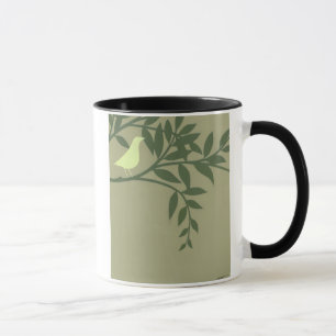 Grüner Vogel gehockt auf grüner Niederlassung Tasse