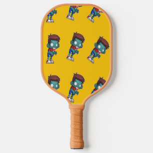 Grünes Zombie-Kind in Orange Pickleball Schläger