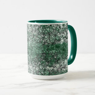 Grünölstruktur auf Stöcken und Fäden Tasse