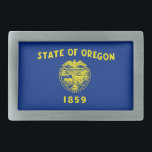 Gürtelschnalle mit Flagge des Oregon-Staat<br><div class="desc">Erleben Sie Ihr Accessoires-Spiel mit einem kühnen Statement-Stück: Unser Gürtelschnalle mit der Flagge von Oregon! Diese auffällige Gurtschnalle ist mehr als nur ein funktionales Element, sie ist eine stilvolle Hommage an Oregons Erbe und eine unverwechselbare Art, Ihren Staatsstolz zu zeigen. Das Design zeigt die ikonische Oregon-Staatsflagge und ist damit eine...</div>