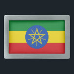 Gürtelschnalle mit Flagge in Äthiopien<br><div class="desc">Dieses auffällige Gürtelschnalle mit der Flagge von Äthiopien ist ein gewagtes Statement, das jedem Outfit eine patriotische Touch verleiht. Dieses Gürtelschnalle mit dem symbolträchtigen Emblem in der Mitte zeigt die lebhaften Farben Grün, Gelb und Rot und ist perfekt für alle, die auf die reiche Geschichte und Kultur Äthiopiens stolz sind....</div>