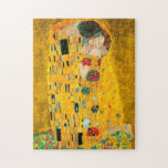 Gustav Klimt Der Kiss<br><div class="desc">Puzzle mit Gustav Klimts Ölgemälde mit Goldblatt Der Kuss (1908). Ein Mann und eine Frau,  die leuchtende goldene Farben tragen,  sich liebevoll umarmen und in einem Feld von Blume küssen. Ein großartiges Geschenk für Jugendliche und österreichische Kunstliebhaber.</div>