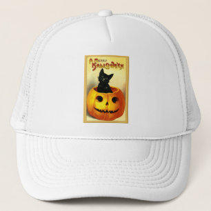Halloween Kitty sitzt in der Kürbislaterne Truckerkappe