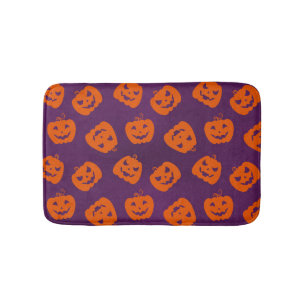 Halloween Pumpkins im Lila Hintergrundemuster Badematte