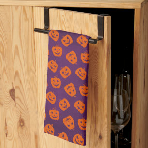 Halloween Pumpkins im Lila Hintergrundemuster Geschirrtuch