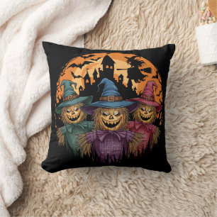 Halloween-Trio unter einem spöttischen Mondlicht Kissen