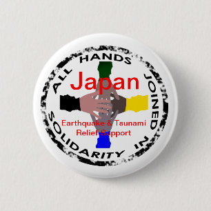 Hände im Entlastungs-Knopf solidaritäts-Japans Button