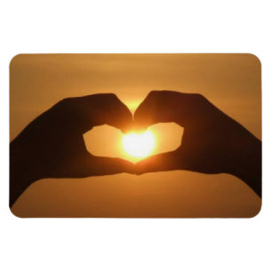 Hände im Sunset Magnet
