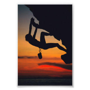 Hängender Kletterer am Sonnenaufgang Fotodruck