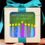 Hanukkah Blue Boho Candles Green Peace Liebe Light Quadratischer Aufkleber<br><div class="desc">"Frieden, Liebe und Licht." Eine spielerische, moderne, künstlerische Illustration von Boho Musterkerzen hilft Ihnen, den Urlaub in Hanukka zu beginnen. Die blauen Kerzen mit bunten Imitat-Folienmustern überlagern einen reichen, tiefgrünen, strukturierten Hintergrund. Genießen Sie die Wärme und Freude der Ferienzeit, wenn Sie diesen atemberaubenden, farbenfrohen, personalisierten individuelle Name Hanukkah Aufkleber verwenden....</div>