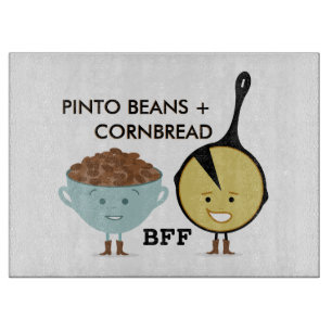 Haricots de Pinto et planche à découper du pain 