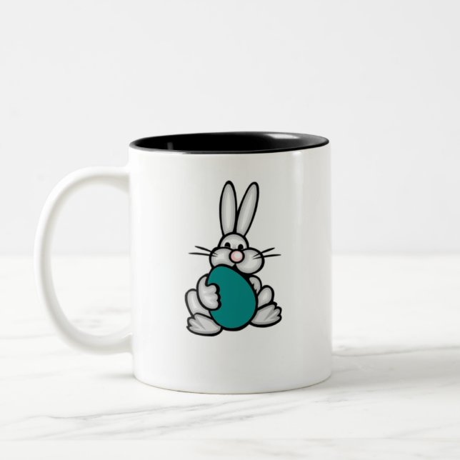 Häschen mit aquamarinem grünem Ei Zweifarbige Tasse (Links)