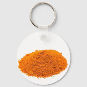 Haufen des Gewürz-Cayenne-Pfefferpulvers auf Wei Schlüsselanhänger