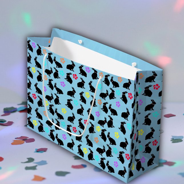 Haufen schwarzer Silhouette Kaninchen Blume Blau Große Geschenktüte (black sitting rabbits colourful flowers on blue gift bag for Easter for spring time.)