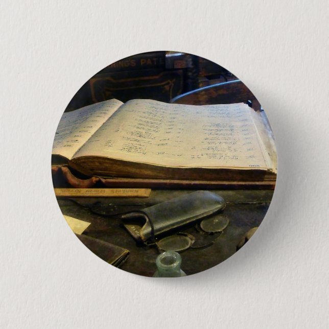 Hauptbuch und Brillen Button (Vorderseite)
