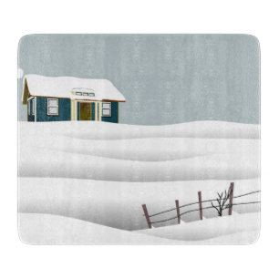 Haus in einer verschneiten Landschaft Schneidebrett