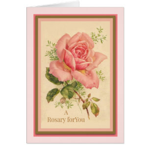 Heiliges Rosenbeet mit rosa Rosen Gebet