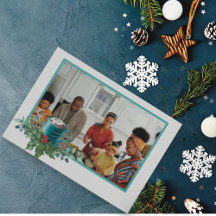 Heiße Schokolade mit Holly und Grünpflanzen Foto