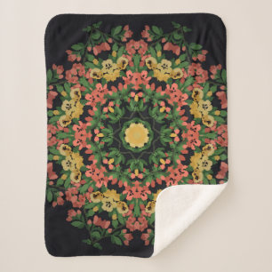 Helle Blumenmandala mit roten und gelben Blumen. Sherpadecke