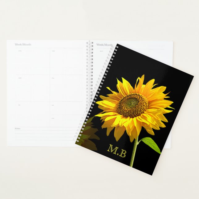 Helle Sonnenblume im schwarzen Hintergrund Planer (Anzeige)