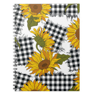 Helle Sonnenblumen-Blume auf karierten Pflastern.  Notizblock