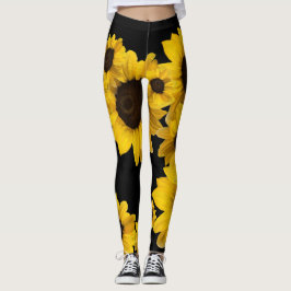 Hellgelbe Sonnenblumen auf schwarzem Hintergrund Leggings