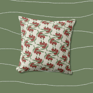 Hellgelbes Kissen mit rotem Olivenmuster