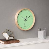 Hellgrüne Uhr und schwarze Stunden