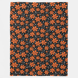 Hellorange Blume auf schwarzem Hintergrund mit w Fleecedecke