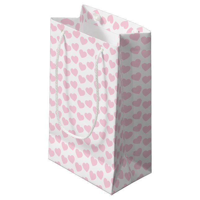 Hellrosa Herz-Muster auf weißer kleiner Kleine Geschenktüte (Vorderseite Schrägansicht)